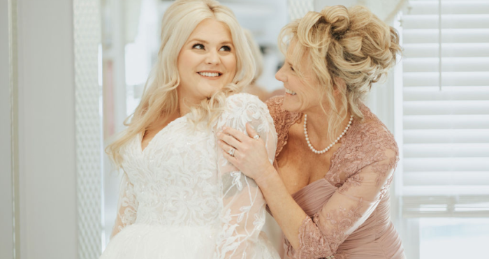 Mother and daughter wearing a Maggie Sottero wedding dress