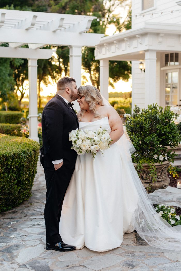 Bride wearing Aspen by Sottero and Midgley in her bridal photos as wedding inspo with her husband