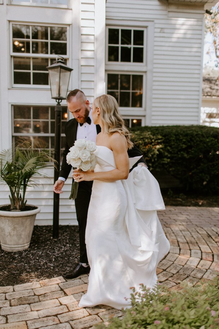 Bride wearing Mitchell by Maggie Sottero with her husband