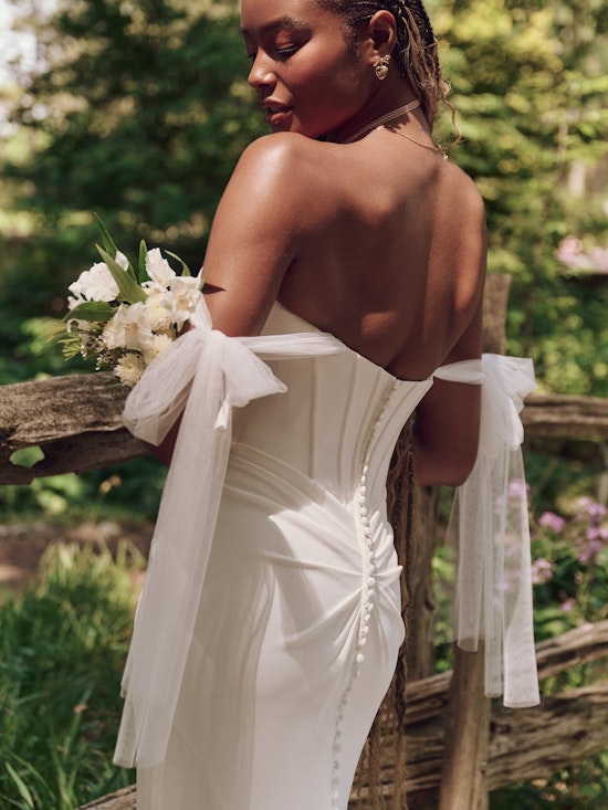 Bride wearing dress with wedding bows called Jace by Maggie Sottero