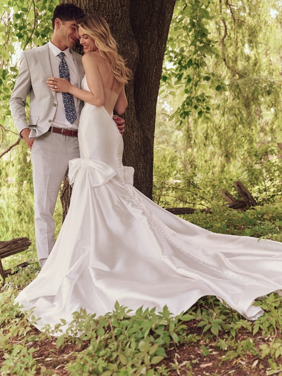 Bride wearing dress with wedding bows called Valeska by Maggie Sottero