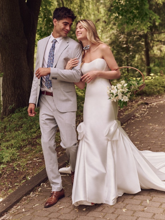 Bride wearing dress with wedding bows called Valeska by Maggie Sottero