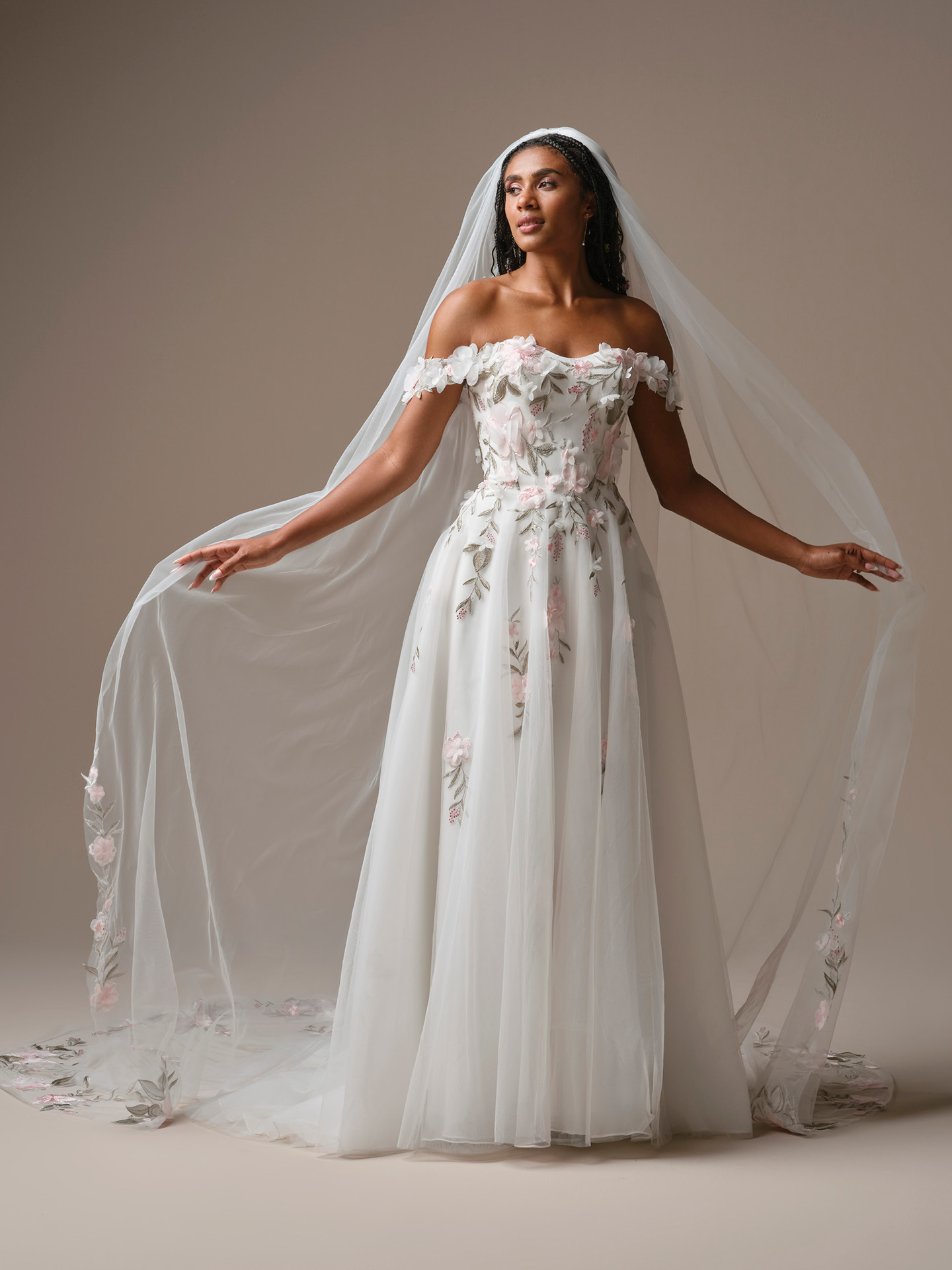 Soft tulle cathedral-length veil with delicate pink floral embroidery and subtle greenery detailing along the edges.