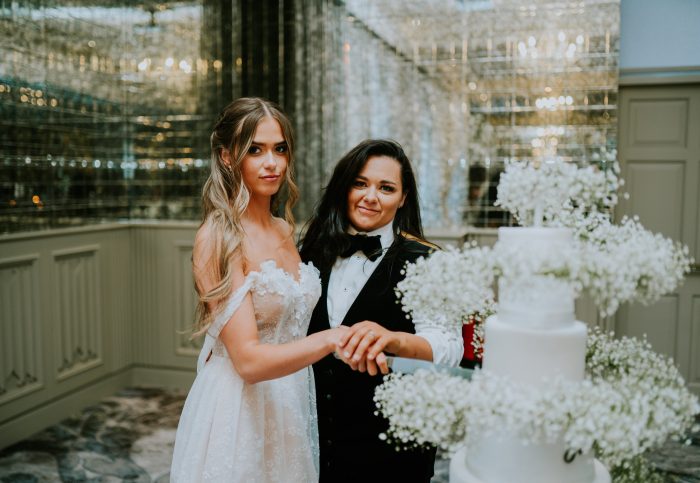 Erin Riley wearing Zoe by Rebecca Ingram as her reception dress