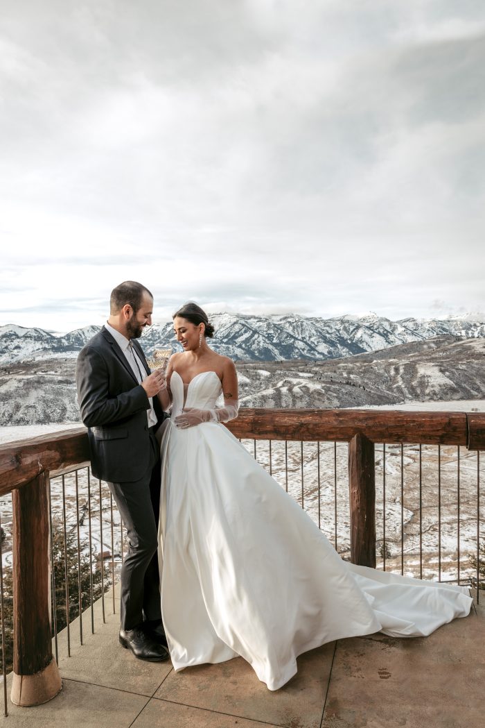 Bride wearing Fortune by Maggie Sottero with her husband outside