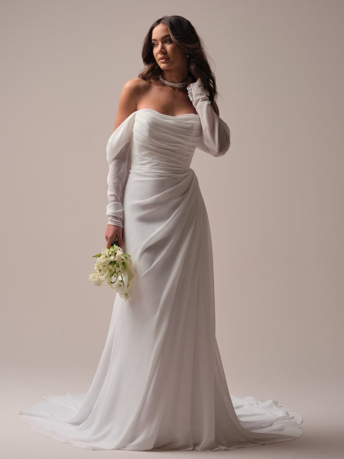 Bride wearing an A-line chiffon wedding dress made of lower-impact fabrics.