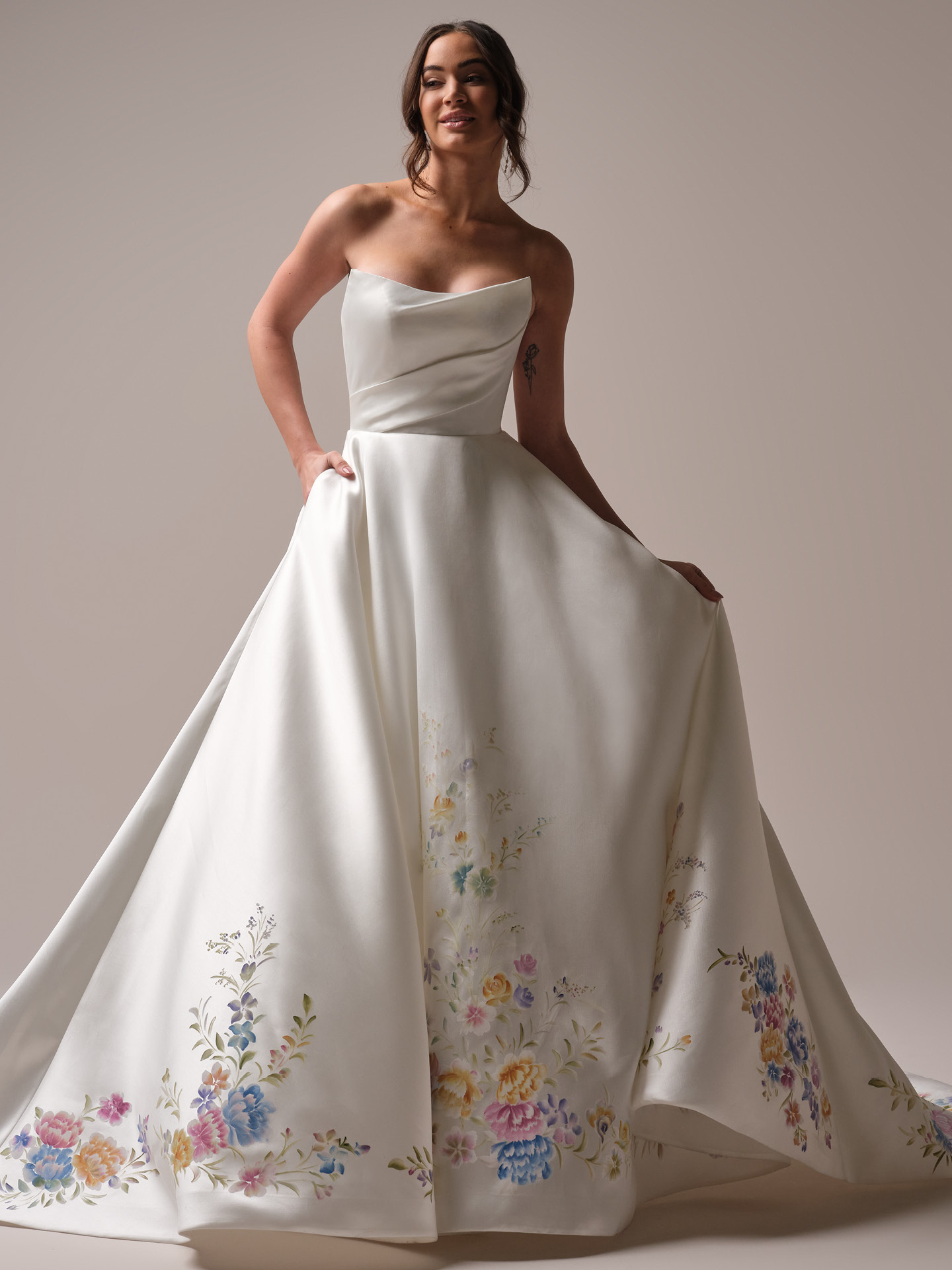 Strapless satin A-line wedding dress with hand-painted floral details and softly draped bodice