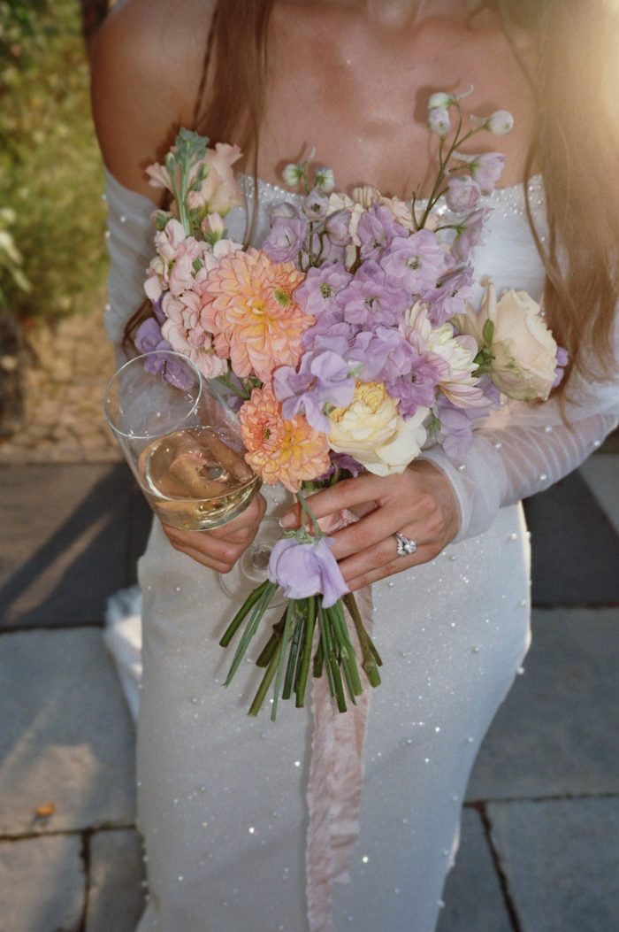 Bride wearing Drew Marie garden party wedding dress by Maggie Sottero