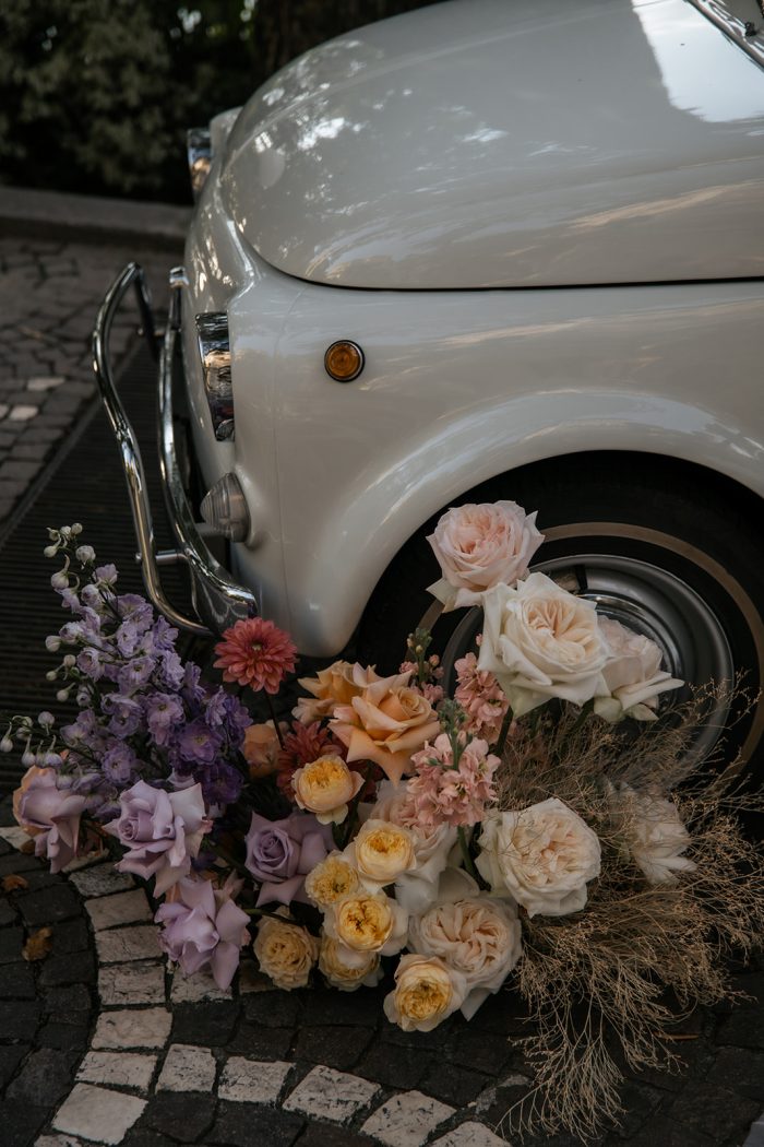 Wedding florals beside a car