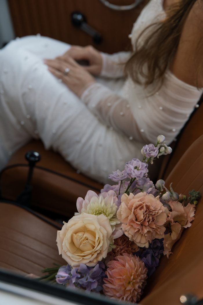 Bride wearing Drew Marie garden party wedding dress by Maggie Sottero