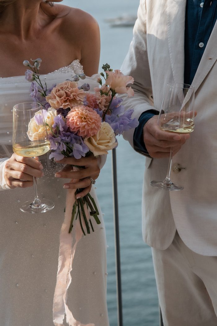 Bride wearing Drew Marie garden party wedding dress by Maggie Sottero