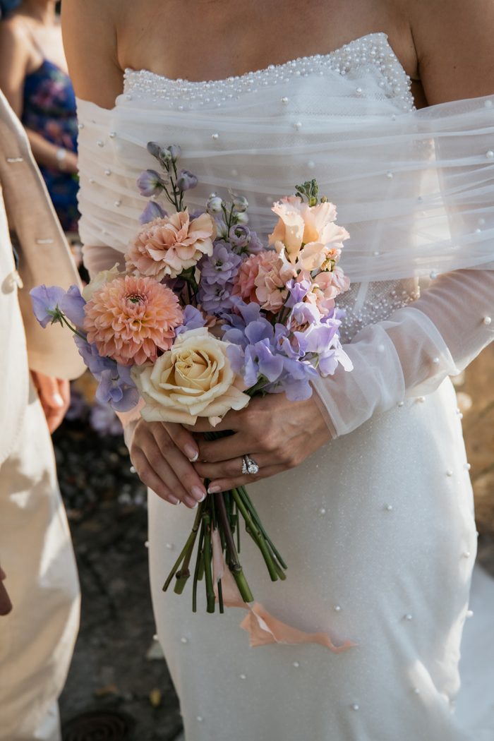 Bride wearing Drew Marie garden party wedding dress by Maggie Sottero