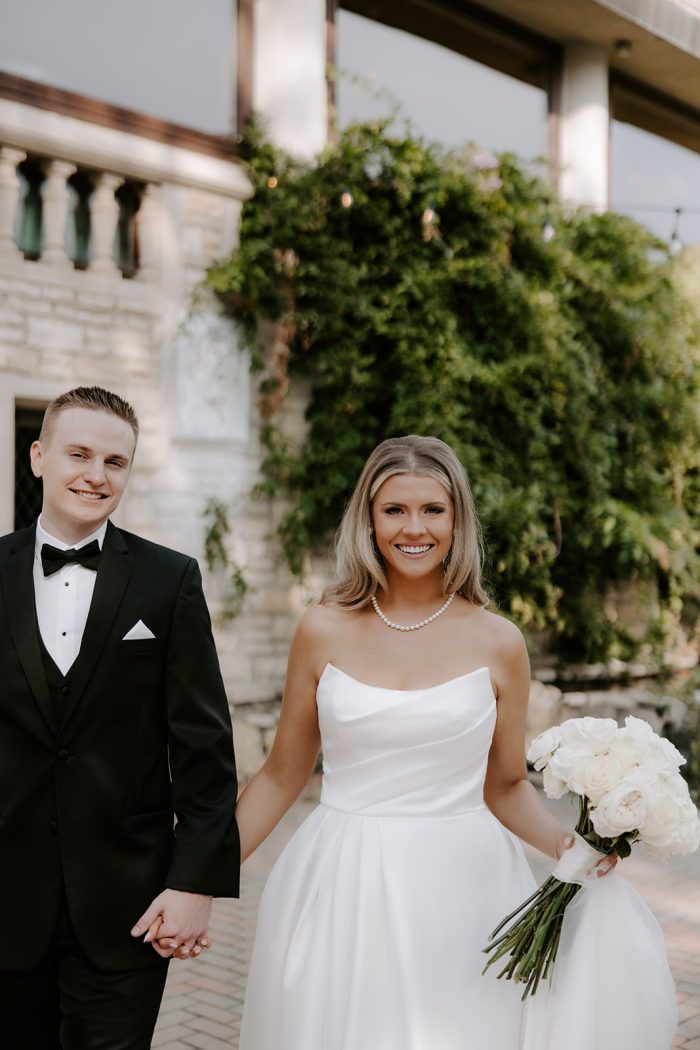 Bride wearing chic simple wedding dress Aspen by Sottero and Midgley