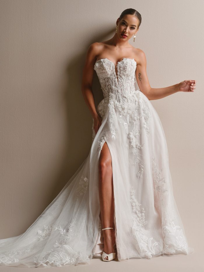 Close-up detail of the Twilight Lane A-line wedding dress by Sottero and Midgley, showing a strapless sweetheart bodice with 3D floral lace appliqué, beading, and delicate sparkle detailing.