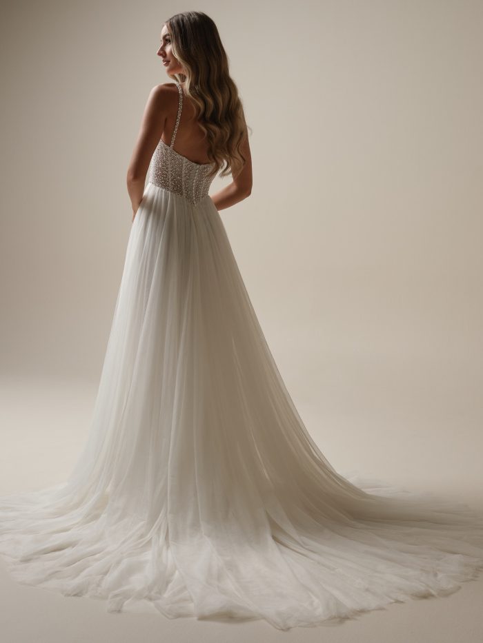 Back view of Gretchen, an A-line wedding dress with a pearl-embellished bodice and soft tulle skirt—modern bridal elegance for the Gen Z bride who loves sparkle and softness.