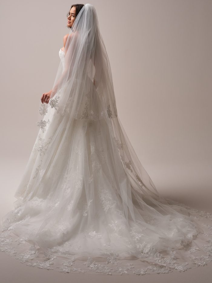 Maggie Sottero Prescott veil featuring cascading floral lace and subtle sparkle. A cathedral-length bridal veil designed to elevate romantic and modern wedding gowns with dramatic flair.