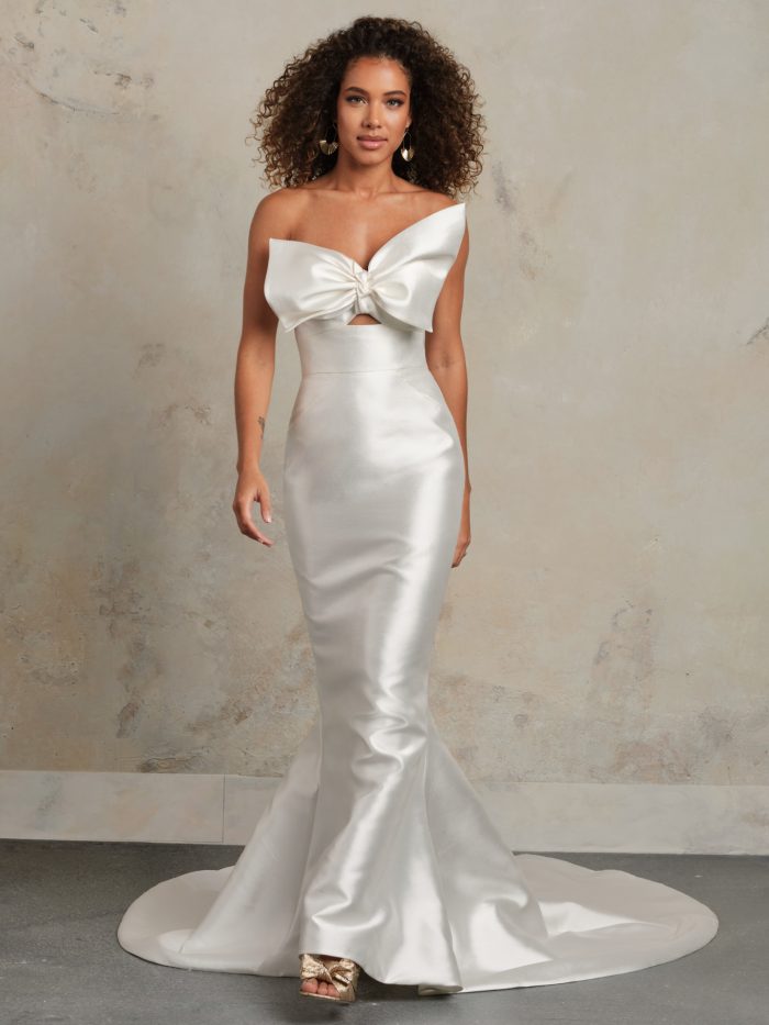 Rebecca Ingram Pezy fit-and-flare bridal gown with a statement satin bow bodice and sweetheart neckline.