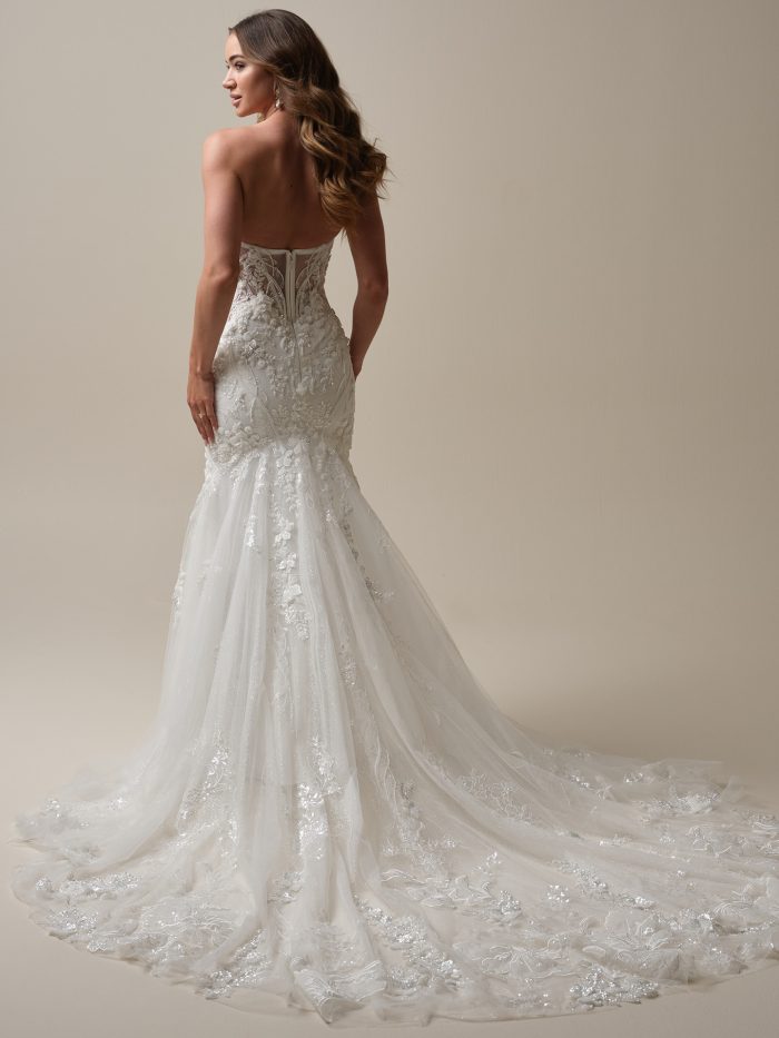 Back view of the Sottero and Midgley Twilight gown—fit-and-flare silhouette with lace and illusion bodice, a stunning option for petite wedding dresses with dramatic trains.