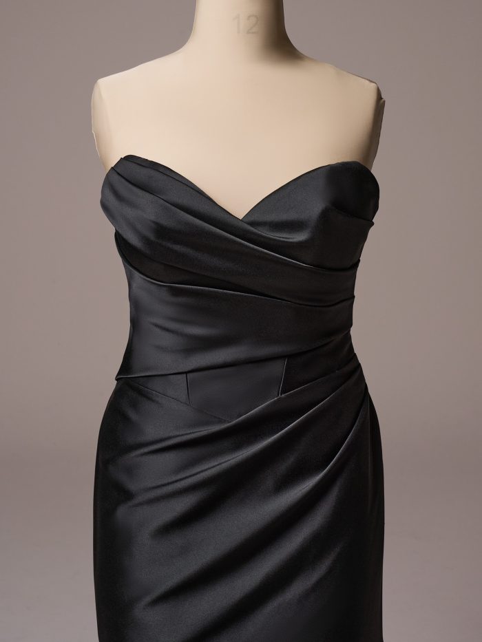 Bodice detail of the Giselle Lane sheath wedding dress by Sottero and Midgley, highlighting a strapless sweetheart neckline with elegant satin draping and smooth, structured shaping through the waist.