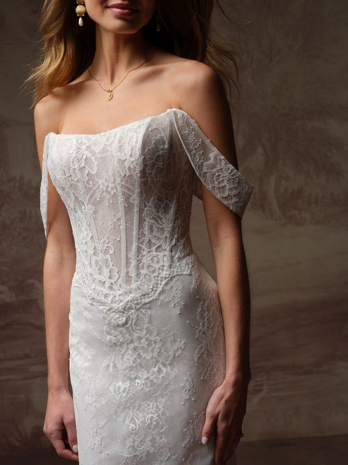 Samira fit-and-flare wedding dress with detachable off-the-shoulder lace sleeves, featuring a sheer corset bodice, floral lace appliqués, and a romantic boho-inspired silhouette.