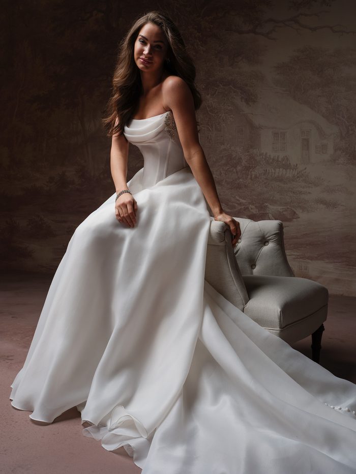 Maggie Sottero Abilene A-line wedding gown with clean satin fabric, elegant draping, and a lengthening silhouette for petite brides