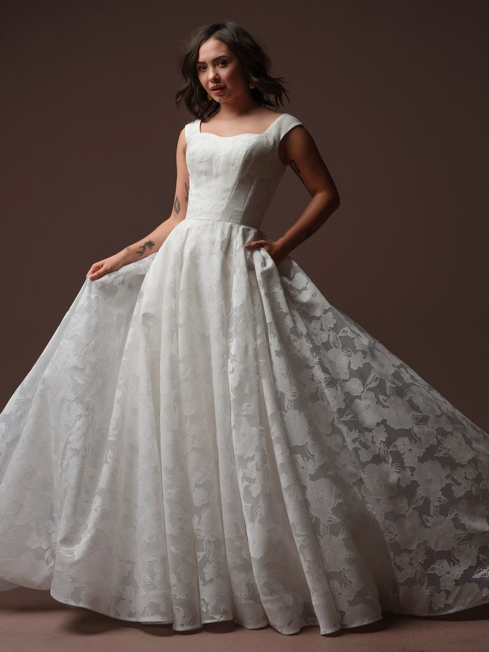 Rebecca Ingram Jade A-line wedding gown with floral jacquard fabric, a structured bodice, and a full skirt for petite brides