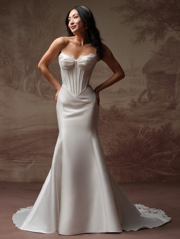 Rebecca Ingram Zorina Lane fit-and-flare wedding gown featuring a corset-inspired bodice, strapless neckline, and sleek silhouette that flatters petite brides.