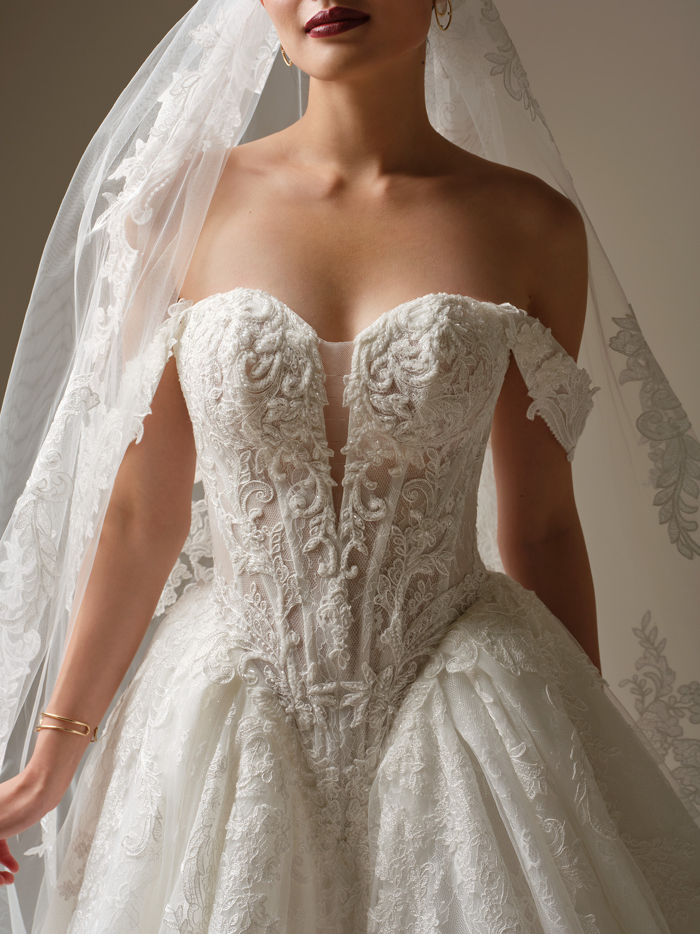 Sottero and Midgley Zulani wedding dress close-up of strapless corset bodice with illusion plunge and intricate beaded lace detailing, creating a glamorous, couture-inspired silhouette