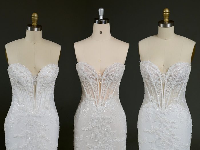 Three versions of the Benjie Royale by Maggie Sottero wedding gown displayed side by side on dress forms. Each gown features a fitted silhouette, a sheer corset bodice with exposed boning, and intricate lace appliqués with beadwork. The center version showcases the most transparent bodice, while the left and right versions feature varying levels of lining and coverage, highlighting customization options within the same romantic, embellished design.