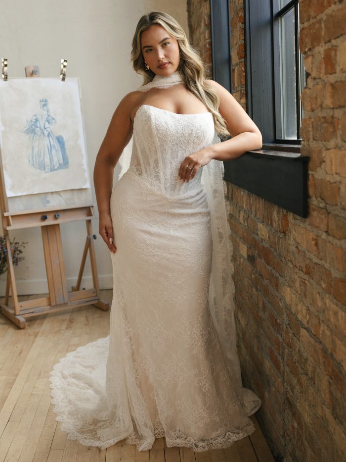 Maggie Sottero Ariadne sheath wedding dress featuring a strapless lace bodice, softly draped silhouette, and fitted skirt that skims the body for an elegant, curve-enhancing look.