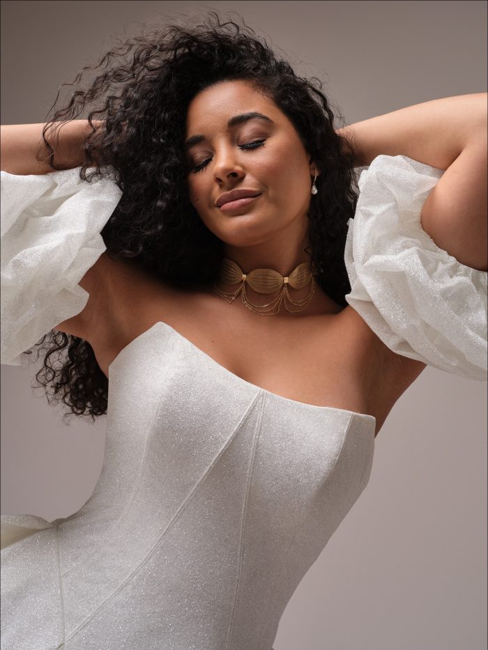 Fortune Royale strapless cat-eye neckline wedding dress by Maggie Sottero with glitter tulle fabric and basque waist bodice.