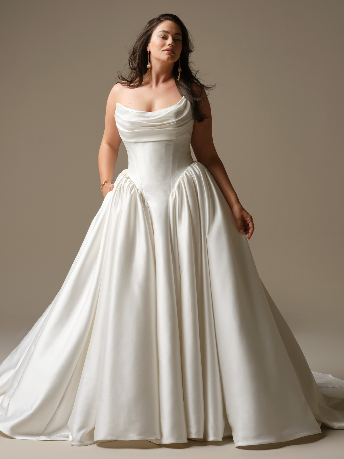 Maggie Sottero Hudson ballgown wedding dress featuring a draped scoop neckline, structured corset bodice, and a full satin skirt for a clean, sculpted, and effortlessly elegant silhouette.