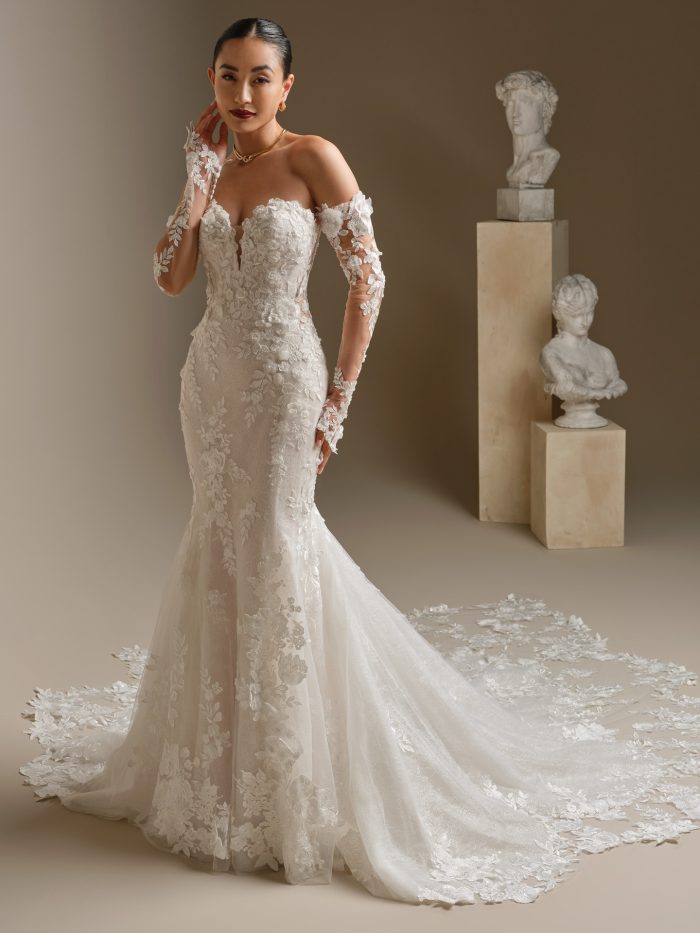 Rashida by Sottero and Midgley luxurious fit-and-flare wedding dress with beaded lace motifs, deep illusion V-neckline, and extended scalloped lace train.
