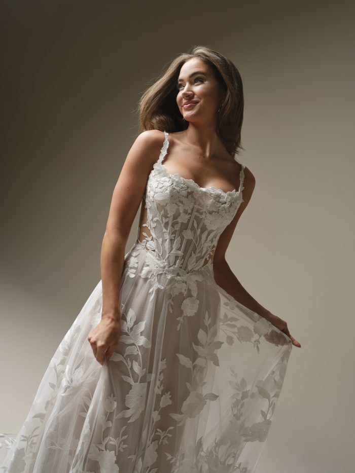 Natalie Marie by Maggie Sottero wedding dress featuring sheer lace bodice, square neckline, and soft floral lace detailing