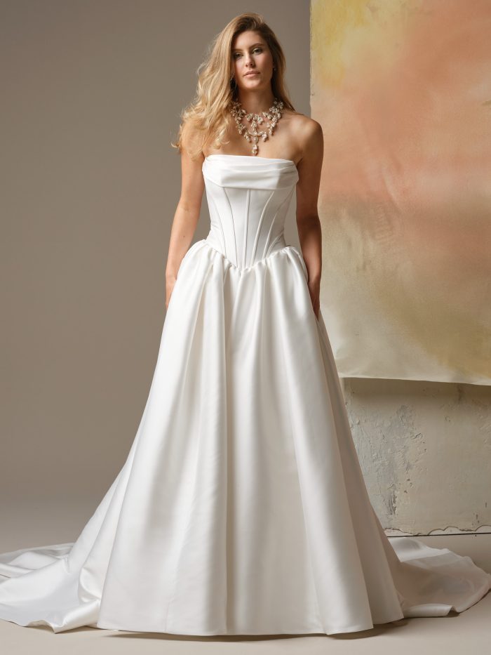 Yuma ball gown wedding dress with strapless corset bodice, dropped waist, and full satin skirt
