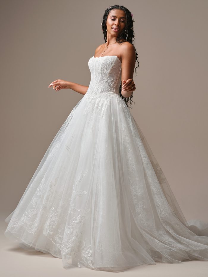 Lisa by Rebecca Ingram strapless ballgown wedding dress with cat eye neckline, sequined lace bodice, and soft tulle skirt