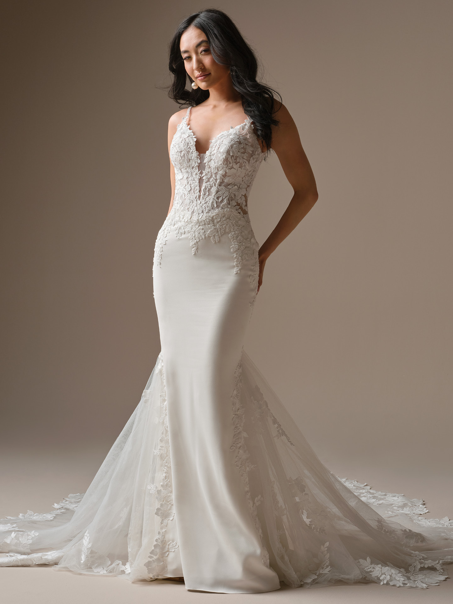 Maggie Sottero Noelle fit-and-flare wedding dress featuring a sculpted silhouette, delicate lace appliqués, and a soft illusion neckline for a modern yet romantic bridal look