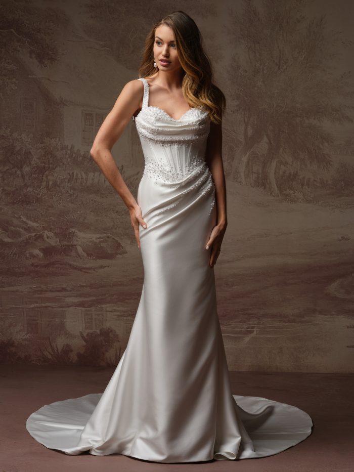 Front view of the Melissa Marie Royale fit-and-flare wedding dress by Maggie Sottero, featuring a beaded sweetheart neckline with wide straps, pearl-embellished corset bodice, and fitted satin skirt with sweeping train.