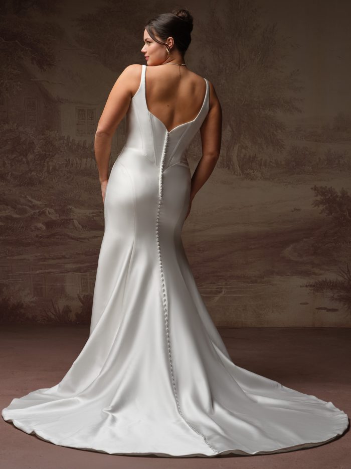 Rebecca Ingram Pamela fit-and-flare wedding dress in ivory, curve fit — square neckline with fitted corset bodice, draped satin skirt with fitted mermaid silhouette and train.