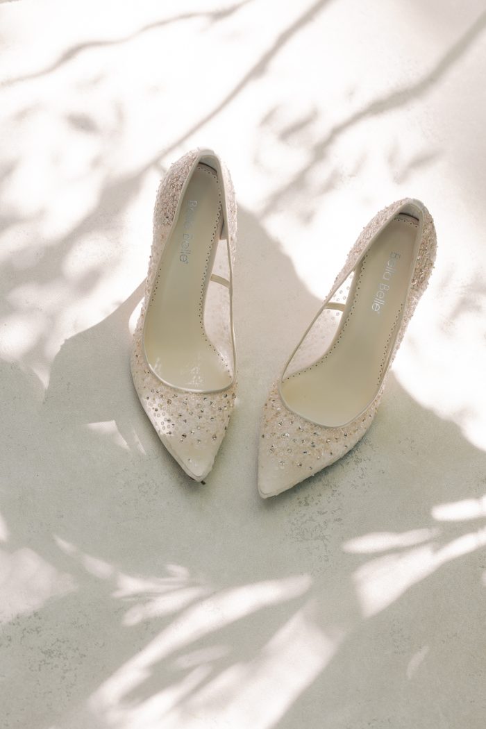Bella Belle pointed-toe wedding heels covered in sequin and crystal embellishment, photographed by Kellie Hetler in dappled natural light.