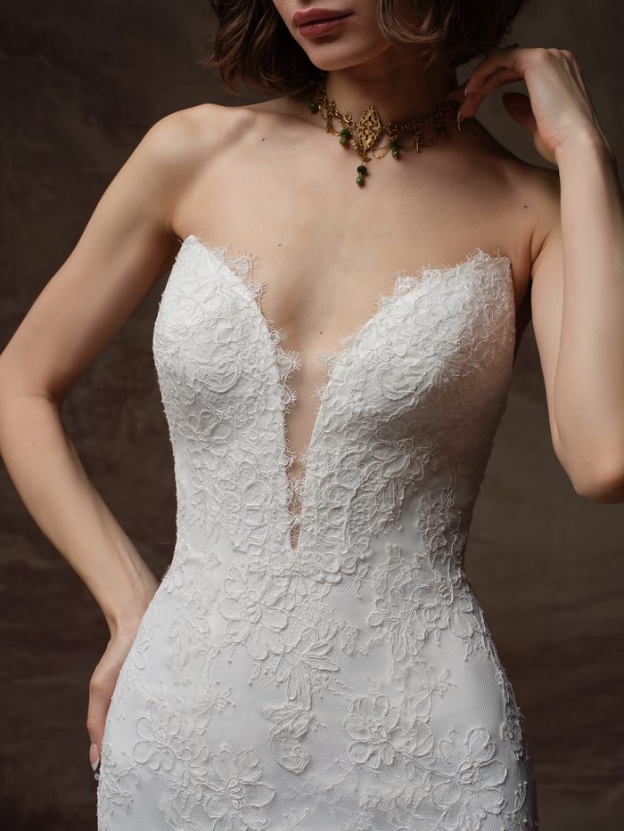 Close-up of the Sauvignon fit-and-flare wedding dress by Sottero and Midgley, showing the strapless lace bodice with a deep plunging sweetheart neckline.