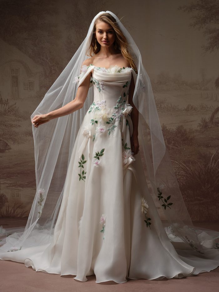 Amaryllis by Sottero and Midgley A-line wedding dress with floral appliqués, detachable off-the-shoulder sleeves, and a matching veil.