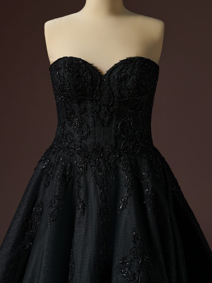 Close-up front view of the Sottero and Midgley Gwyneth ballgown wedding dress in black, featuring a strapless sweetheart neckline, sheer corset-inspired bodice, intricate tonal beadwork and lace appliqués, and a full glitter tulle skirt with ornate embroidered details.