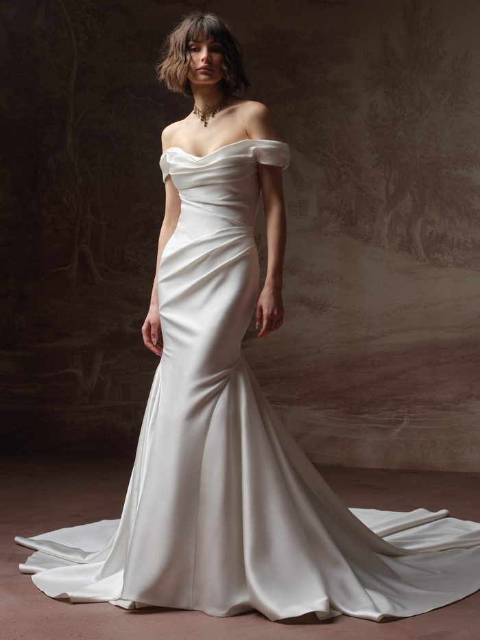 Amaryllis by Sottero and Midgley A-line wedding dress with floral appliqués and a matching veil.